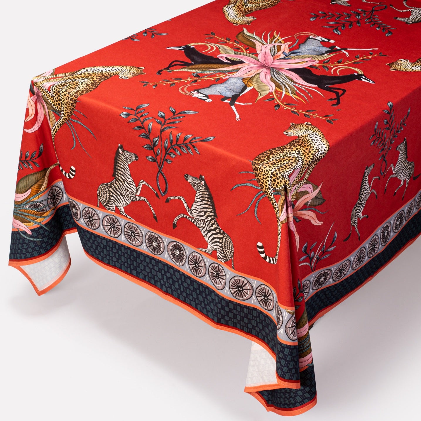 A full-table view showcasing the elegant drape of the tablecloth, highlighting its luxurious design and detailed motifs.
