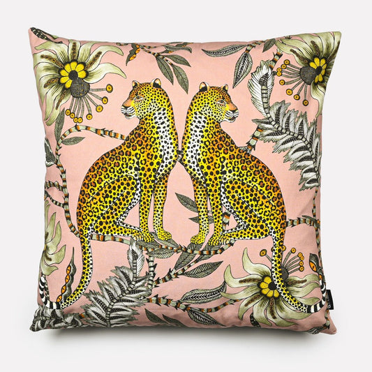 Front view of the Lovebird Leopards Magnolia Cushion Cover featuring a soft pink background with two leopards and floral accents.
