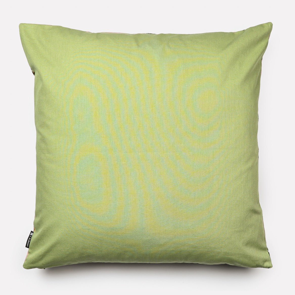 Back view of the Lovebird Leopards Magnolia Cushion Cover in a solid pistachio green cotton fabric.
