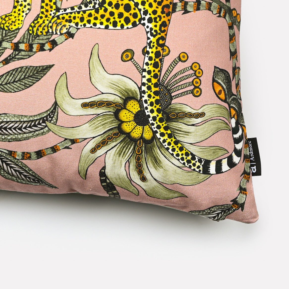 Close-up of the Lovebird Leopards Magnolia Cushion Cover highlighting the intricate floral design and leopard print on pink fabric.