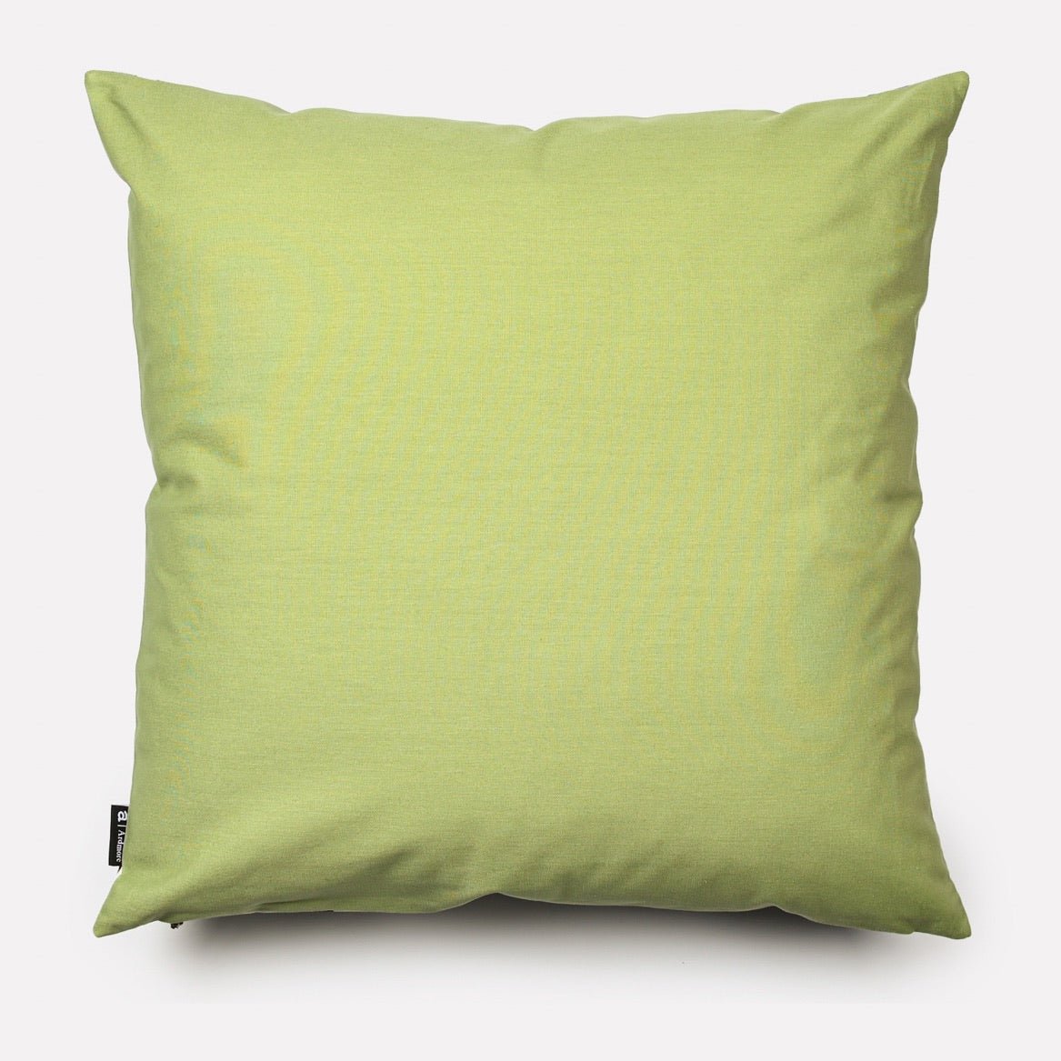 Back view of the Lovebird Leopards Tanzanite Cushion Cover, showcasing a plain pistachio green cotton fabric.