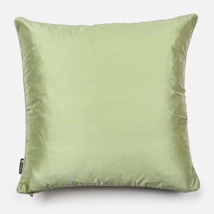 Back view of the Lovebird Leopards Tanzanite cushion cover in soft pistachio-coloured silk, highlighting the smooth texture and subtle elegance.