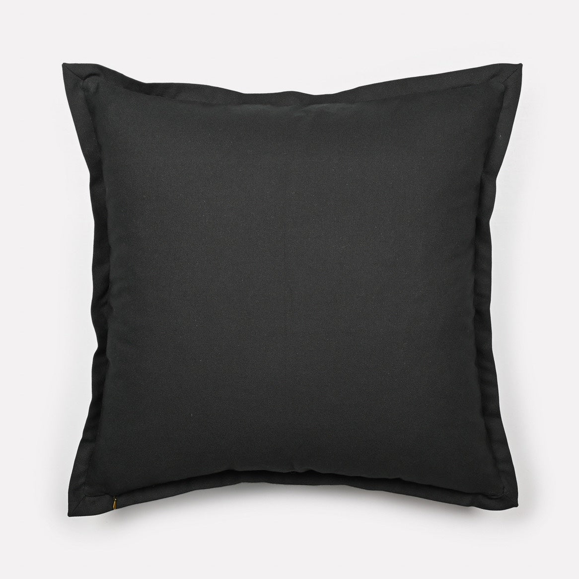 Back view of the Meandering Monkey Oasis cushion cover in solid black fabric with the Ardmore logo.