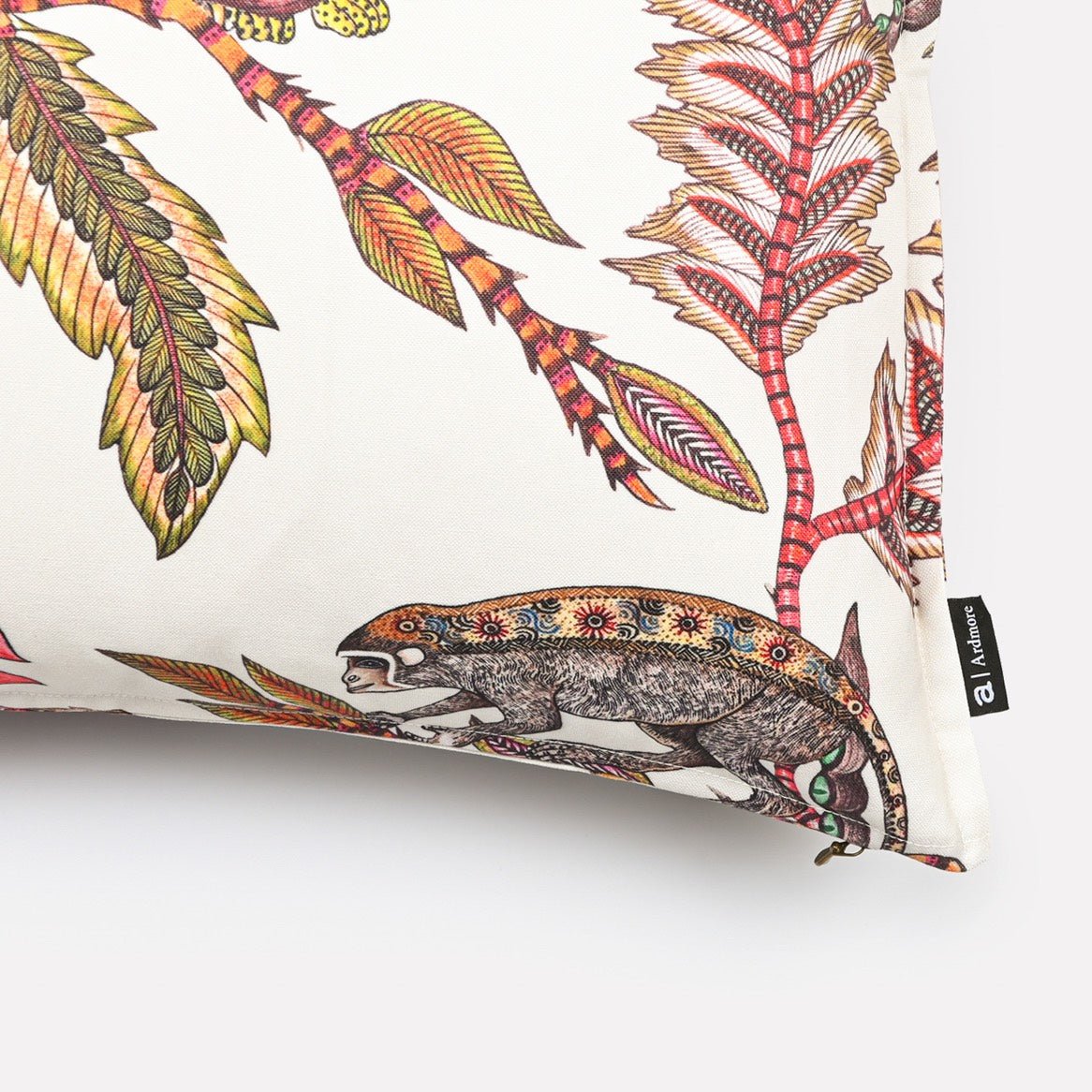 Close-up of the Monkey Bean Parakeet cushion cover, highlighting the intricate details of tropical leaves and a colourful parakeet in the design.