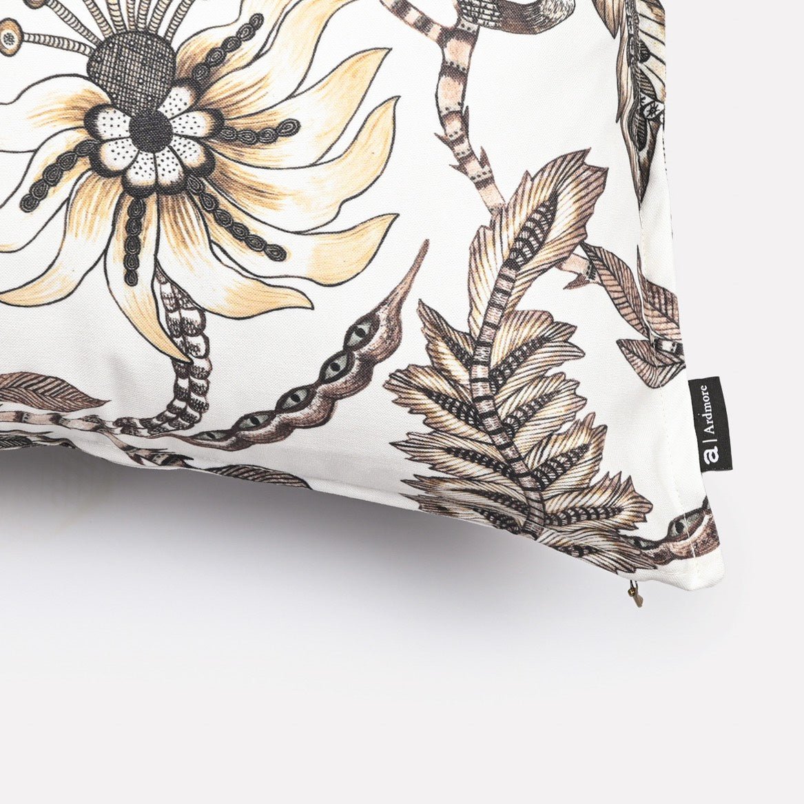 Close-up of the Monkey Bean Stone cushion cover, highlighting a large floral motif surrounded by monkeys and leopards in soft, earthy hues.
