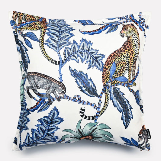 50x50cm double-sided cushion cover in Monkey Bean Tanzanite fabric, featuring a white background with intricate blue and tanzanite-toned illustrations of leopards, monkeys, and floral motifs.