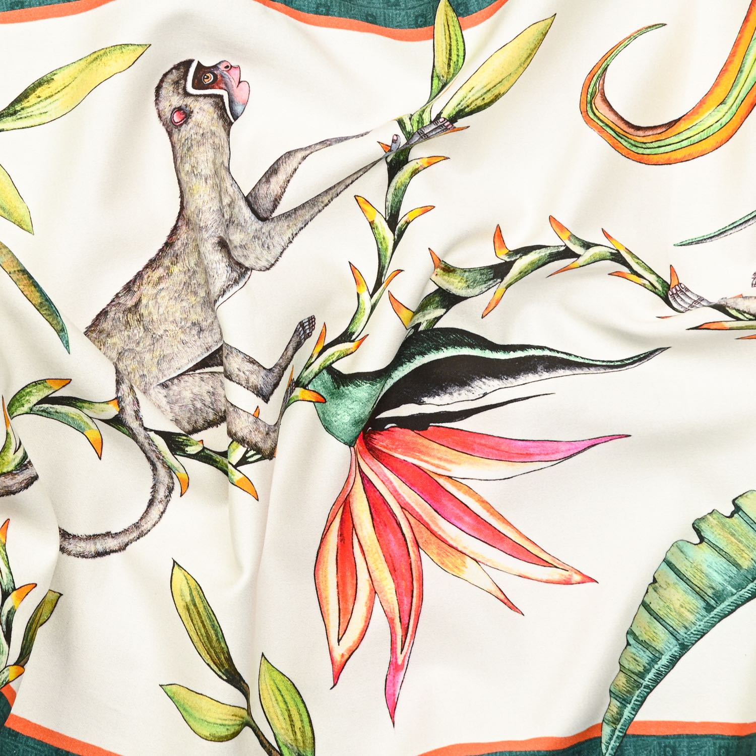 A zoomed-in section highlighting the rich artistic detailing of exotic animals and tropical plant motifs on the fabric.