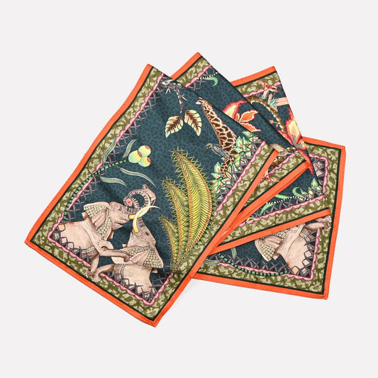 A neatly arranged set of Ardmore's Sabie Forest Table Runners in a rich Delta colour palette, featuring intricate wildlife and lush botanical illustrations.