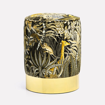 Elegant velvet pouffe featuring Ardmore's Sabie Forest Moonlight design, with intricate golden and black botanical patterns, set atop a gleaming brass base for a touch of luxury.