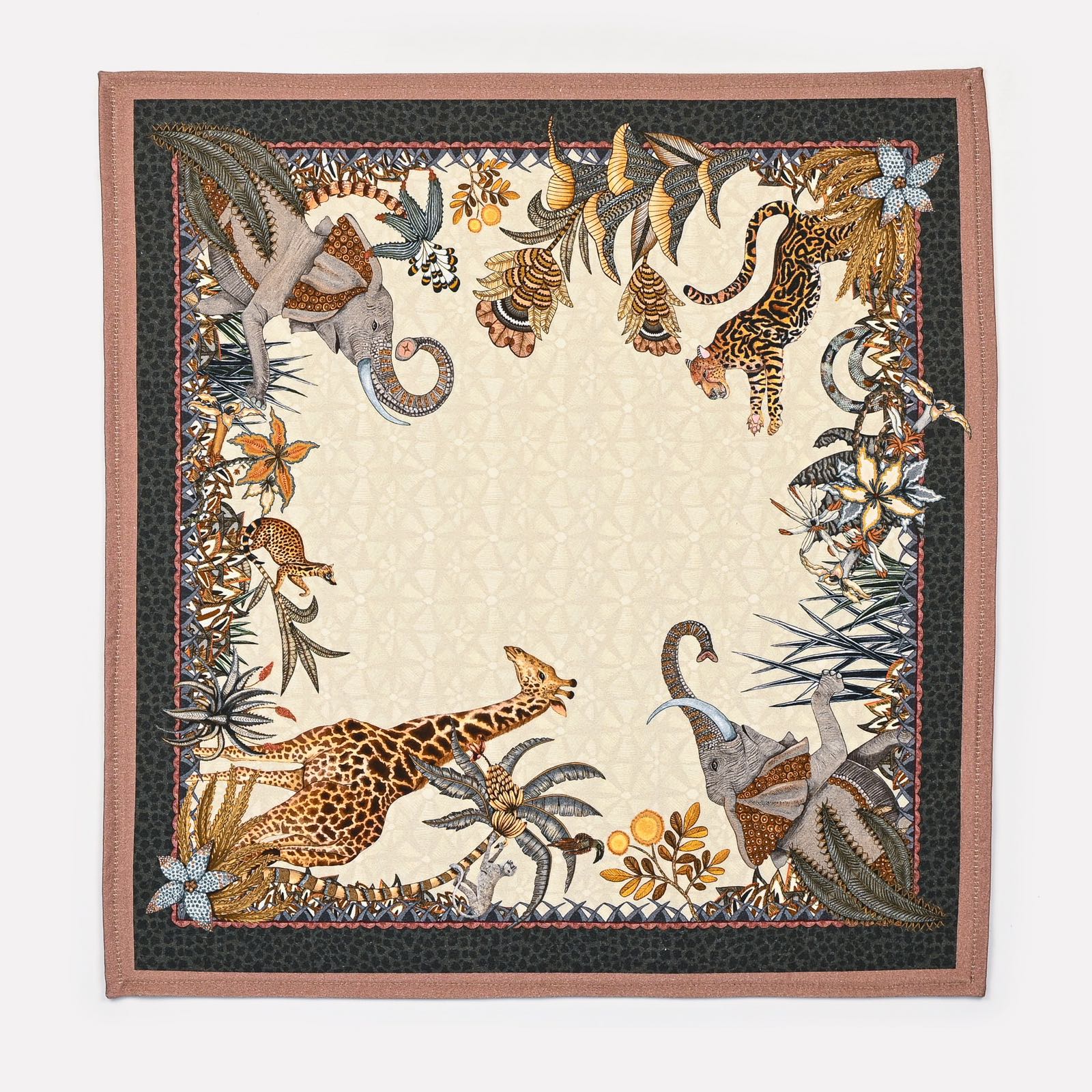 A full view of the Ardmore Sabie Forest Napkin in Stone, showcasing a detailed composition of African flora and fauna, framed by an elegant border.