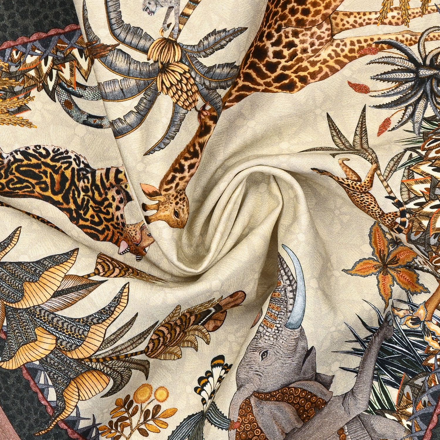 A swirled fabric presentation of the Ardmore Sabie Forest Napkin in Stone, emphasizing the soft cotton material and the flowing, intricate print design.
