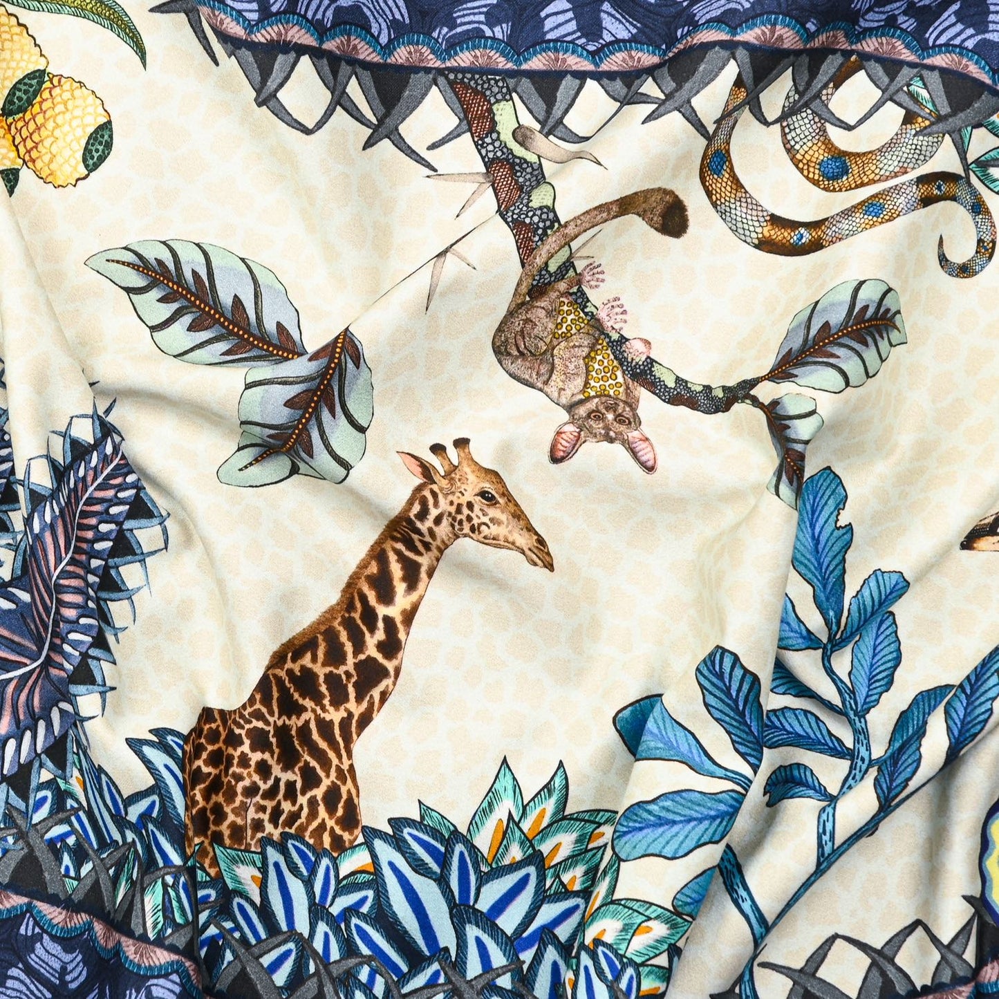 A zoomed-in view of the table runner, featuring lush foliage and exotic animals like leopards and birds, highlighting the fine artistic detailing.