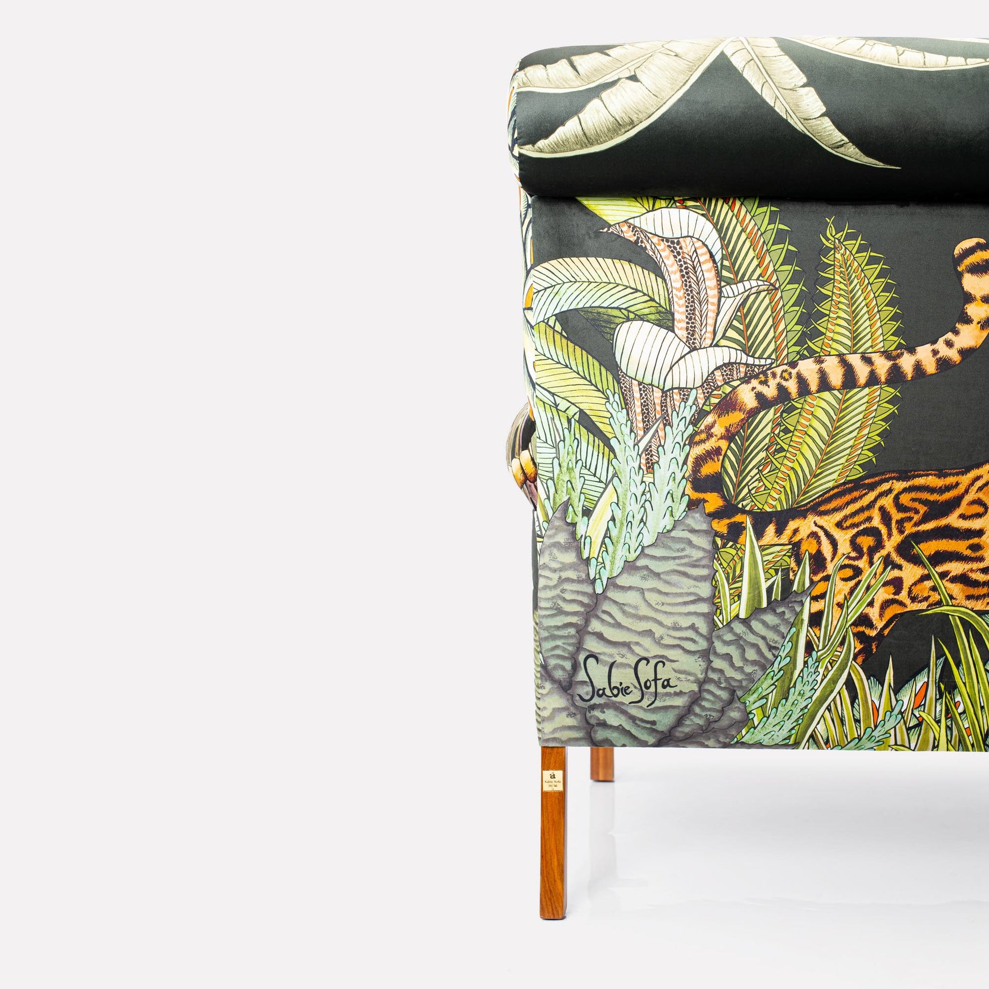 Wooden leg close-up, showcasing the polished mahogany finish that complements the bold upholstery.