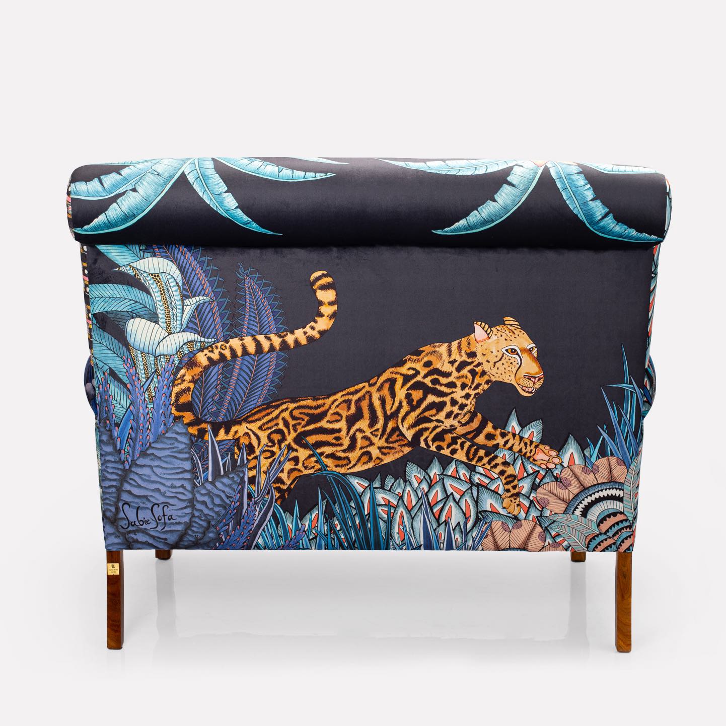 A back-facing image of the sofa, revealing how the intricate tapestry extends seamlessly across the back panel.