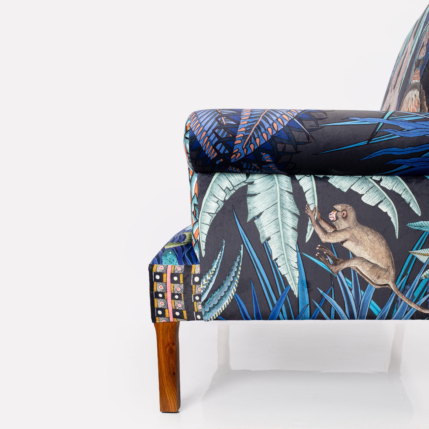 A crop of the lower half, highlighting the legs, seat cushion, and bottom panel design.