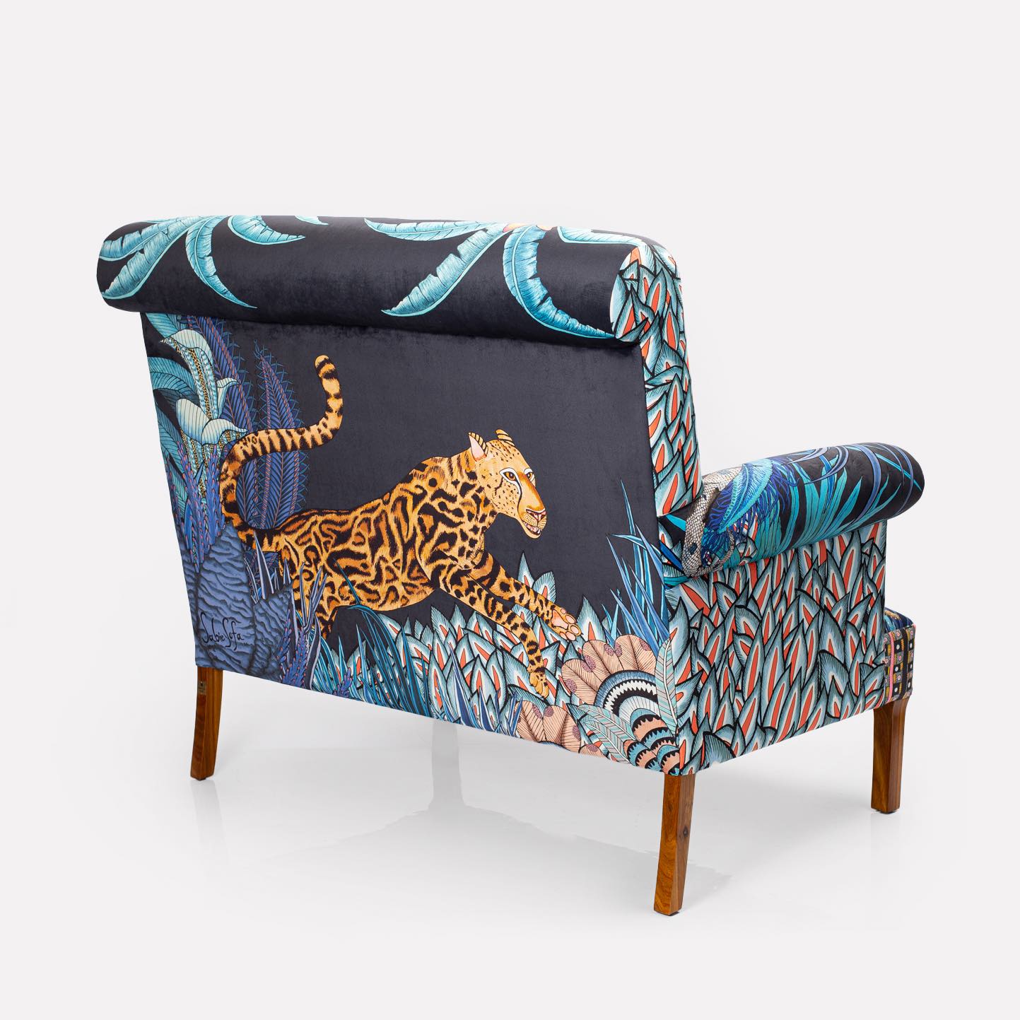 A back-facing image of the sofa, revealing how the intricate tapestry extends seamlessly across the back panel.