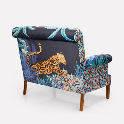 A back-facing image of the sofa, revealing how the intricate tapestry extends seamlessly across the back panel.