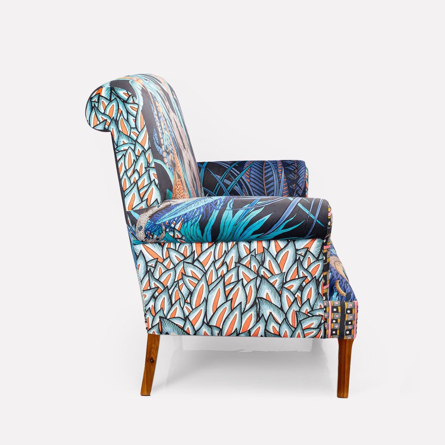 A three-quarter view from the right, highlighting the sofa’s structured form and patterned upholstery.