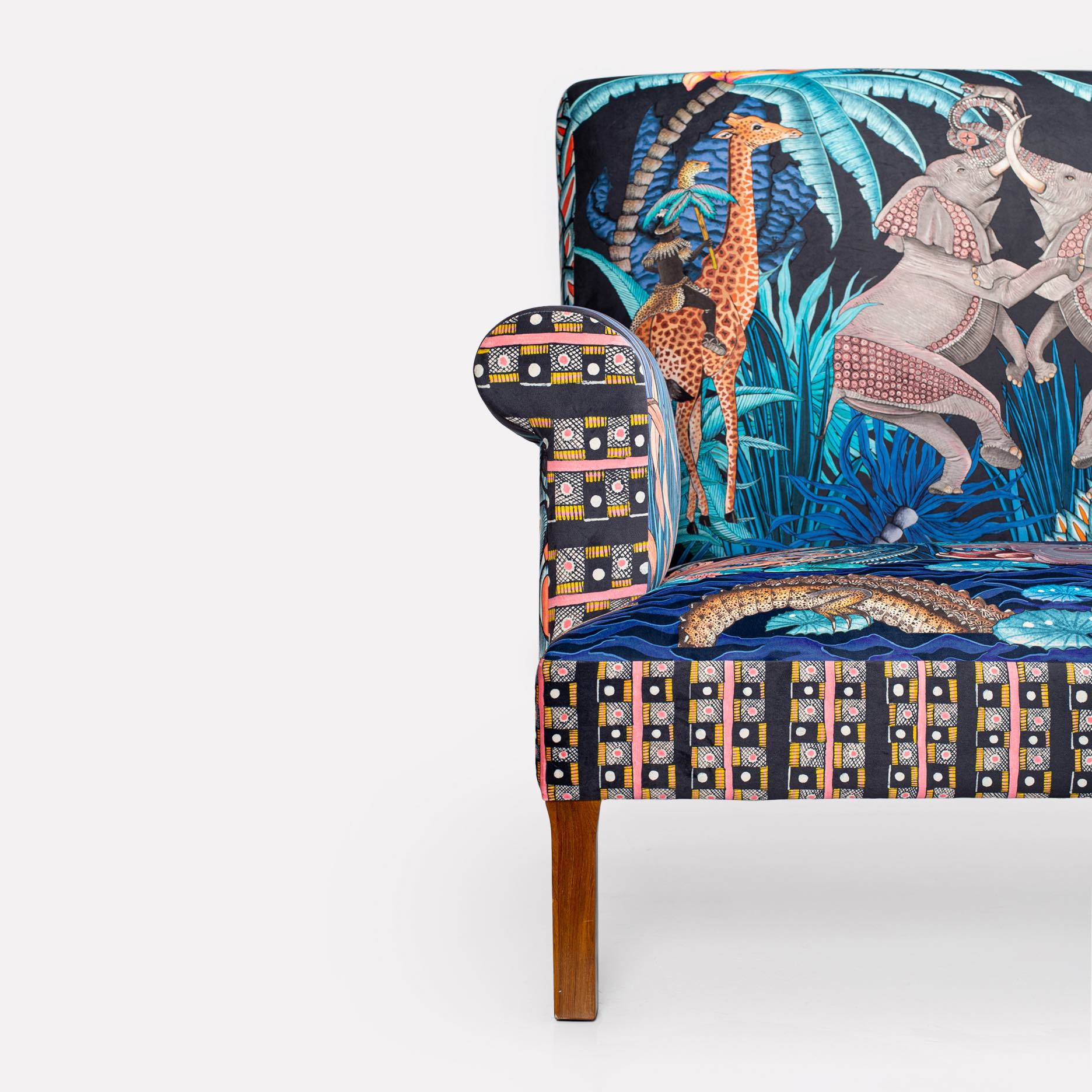 A profile shot of the right side, featuring the continuation of the Tanzanite-inspired fabric over the armrest and side panel.