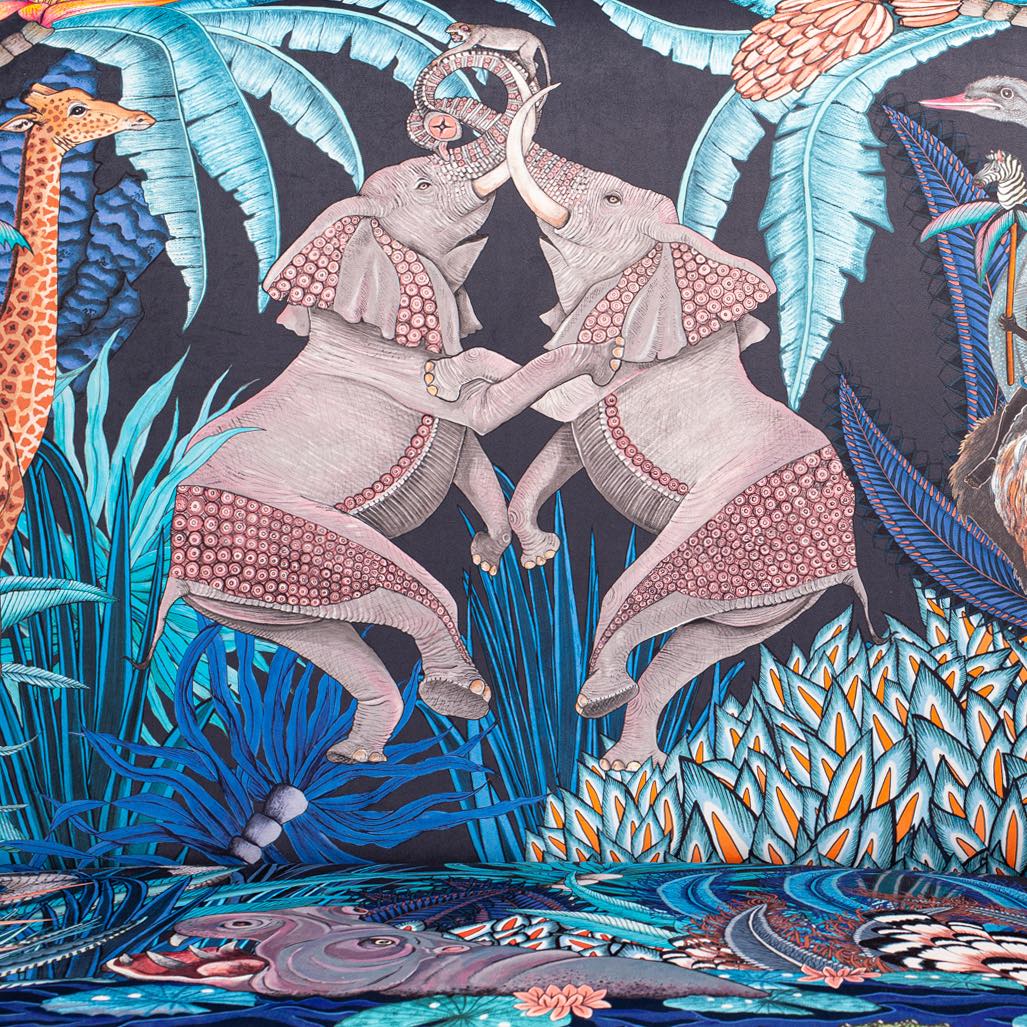 A zoomed-in shot of the plush velvet fabric, emphasising the hand-drawn illustrations of wildlife.