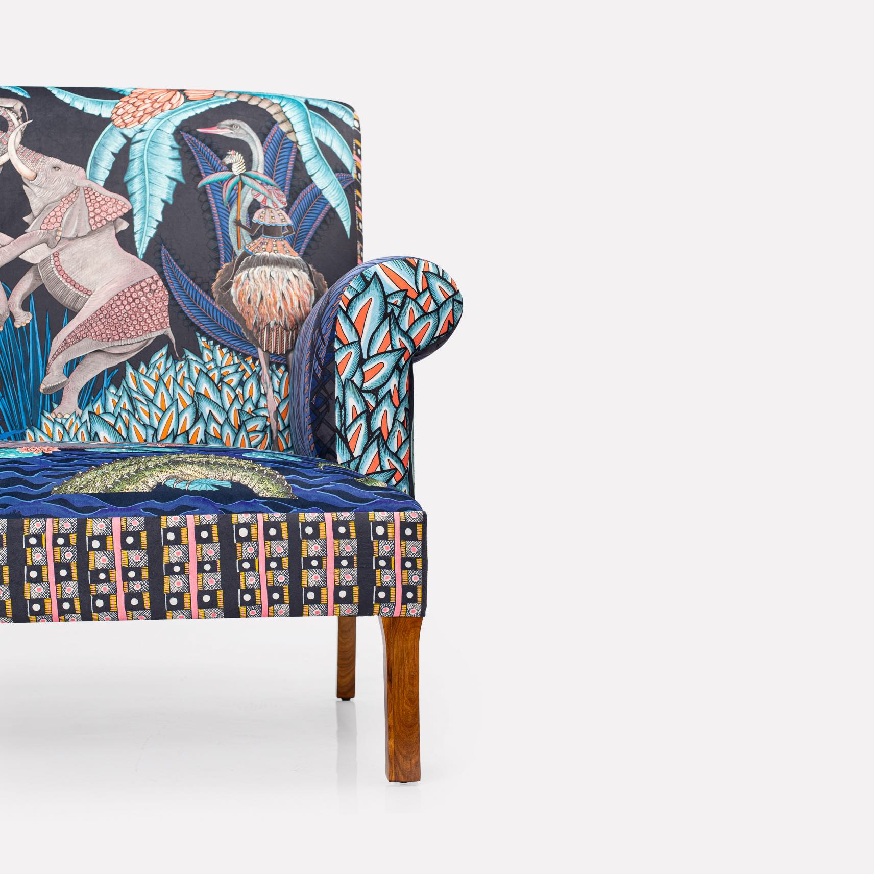 A clean profile shot of the left side, showing the seamless upholstery and smooth wooden legs.