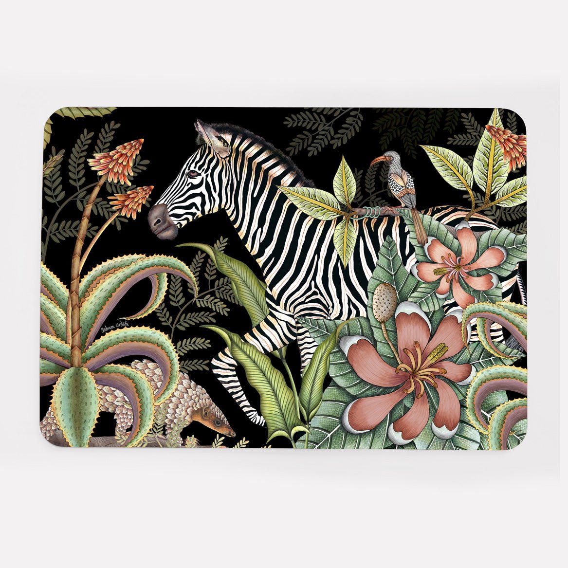  A hardboard placemat featuring a zebra among detailed botanical elements, including magnolias and flowering aloes, set against a striking black background.