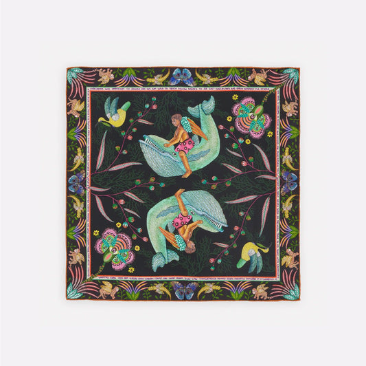 A square silk scarf with a dark moonlit background, adorned with elegant birds in shades of blue and green, surrounded by intricate floral detailing.