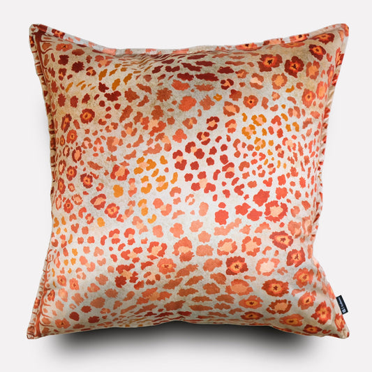 Front view of the Safari Spot Coral Velvet Cushion Cover, showcasing its vibrant coral and orange leopard-print design on a luxurious velvet surface.