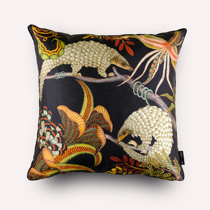 Front view of the Thanda Pangolin in Night Silk Cushion Cover, showcasing a striking design of golden pangolins against a deep black silk background.