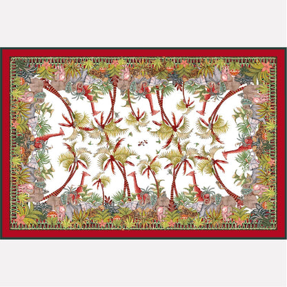 A rectangular tablecloth with a striking royal-themed print, featuring vibrant red and green tropical foliage, birds, and intricate symmetrical patterns framed by a bold red border.